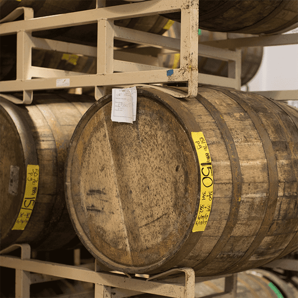Multiple stacked wooden barrels