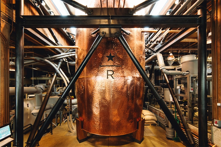 Enormous hammered copper container surrounded by machinery