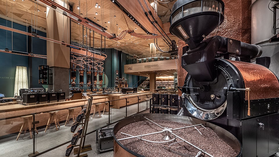 Coffee roasting machinery and the Main Bar on the ground floor of the Tokyo Roastery