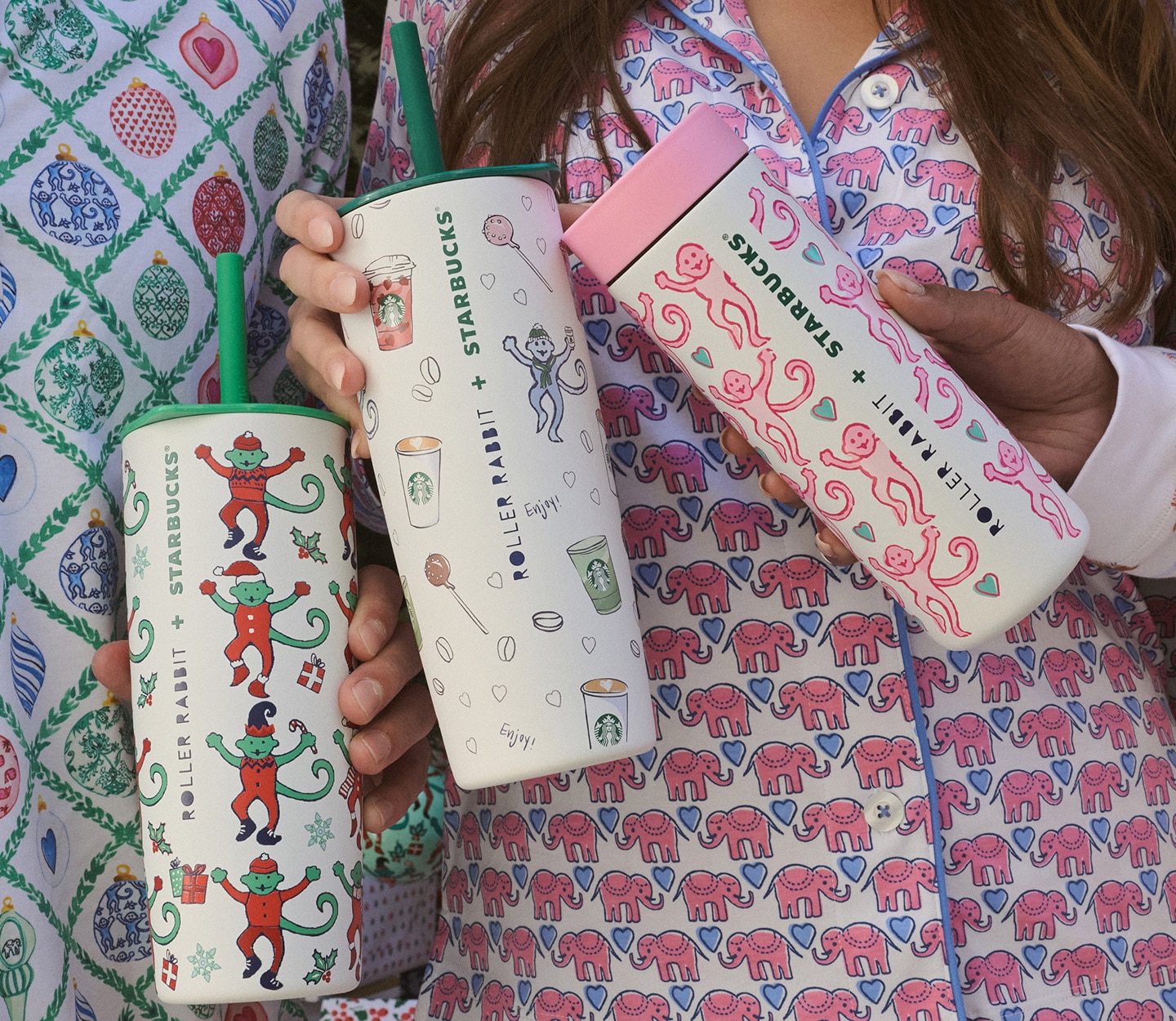 Three friends in patterned pajamas, each holding a different drinkware design.