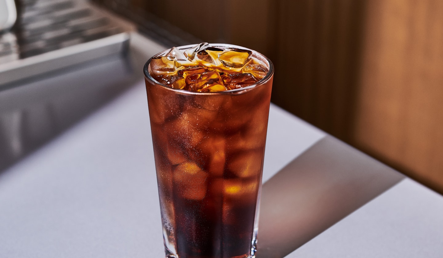 An iced coffee drink in a glass.