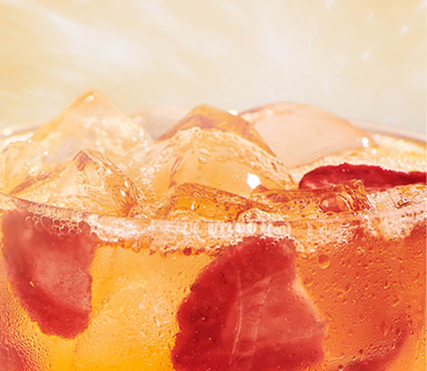 Close-up of Mango Strawberry Energy Refresher in a glass.