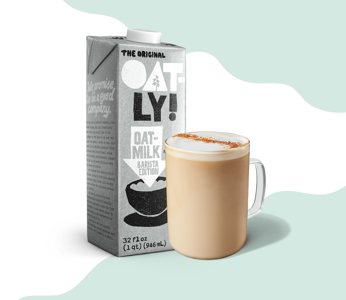 A carton of OATLY Oatmilk sits next to a finished latte in a glass mug.
