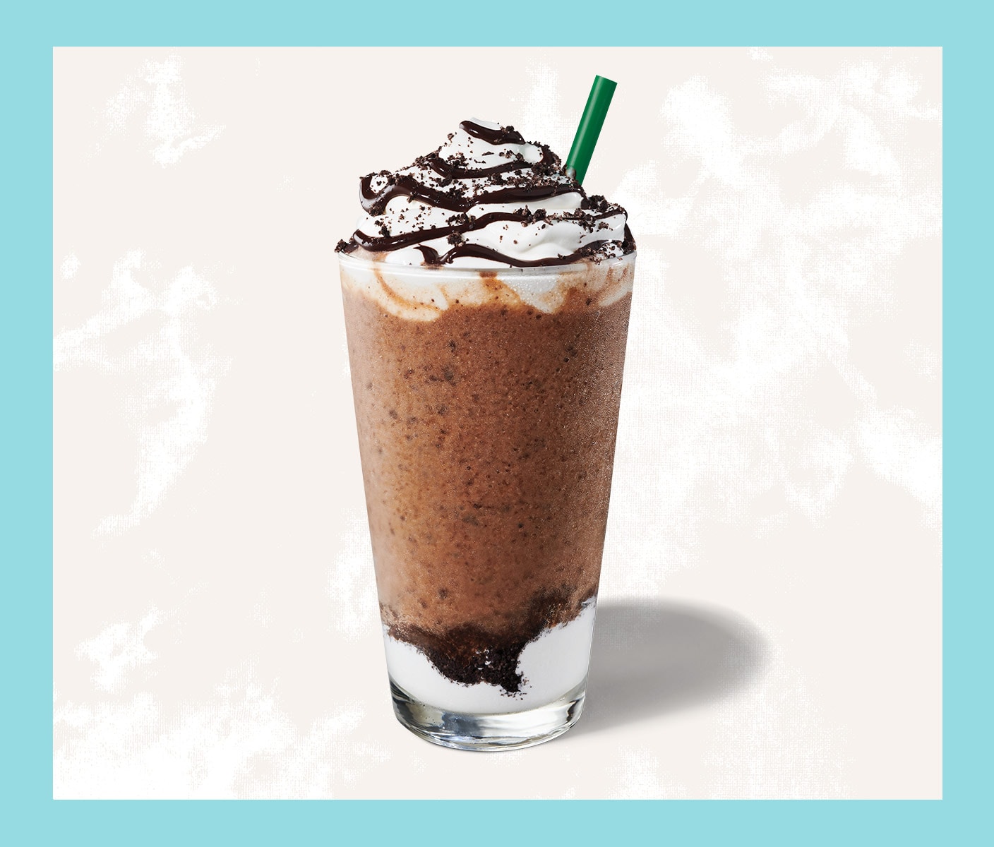 Blended coffee drink with whip cream in a tall glass.