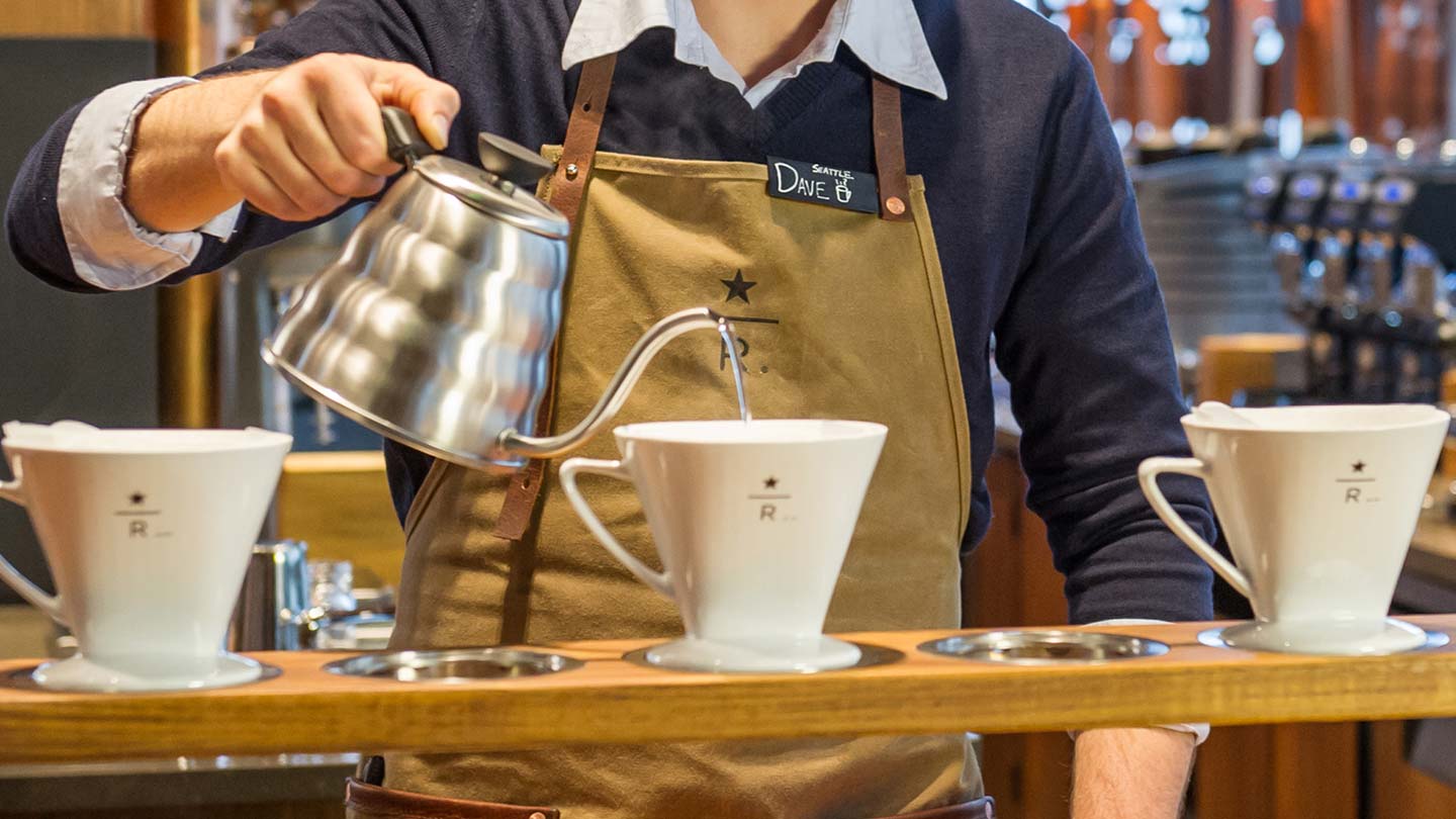 Starbucks barista serving pour over coffee