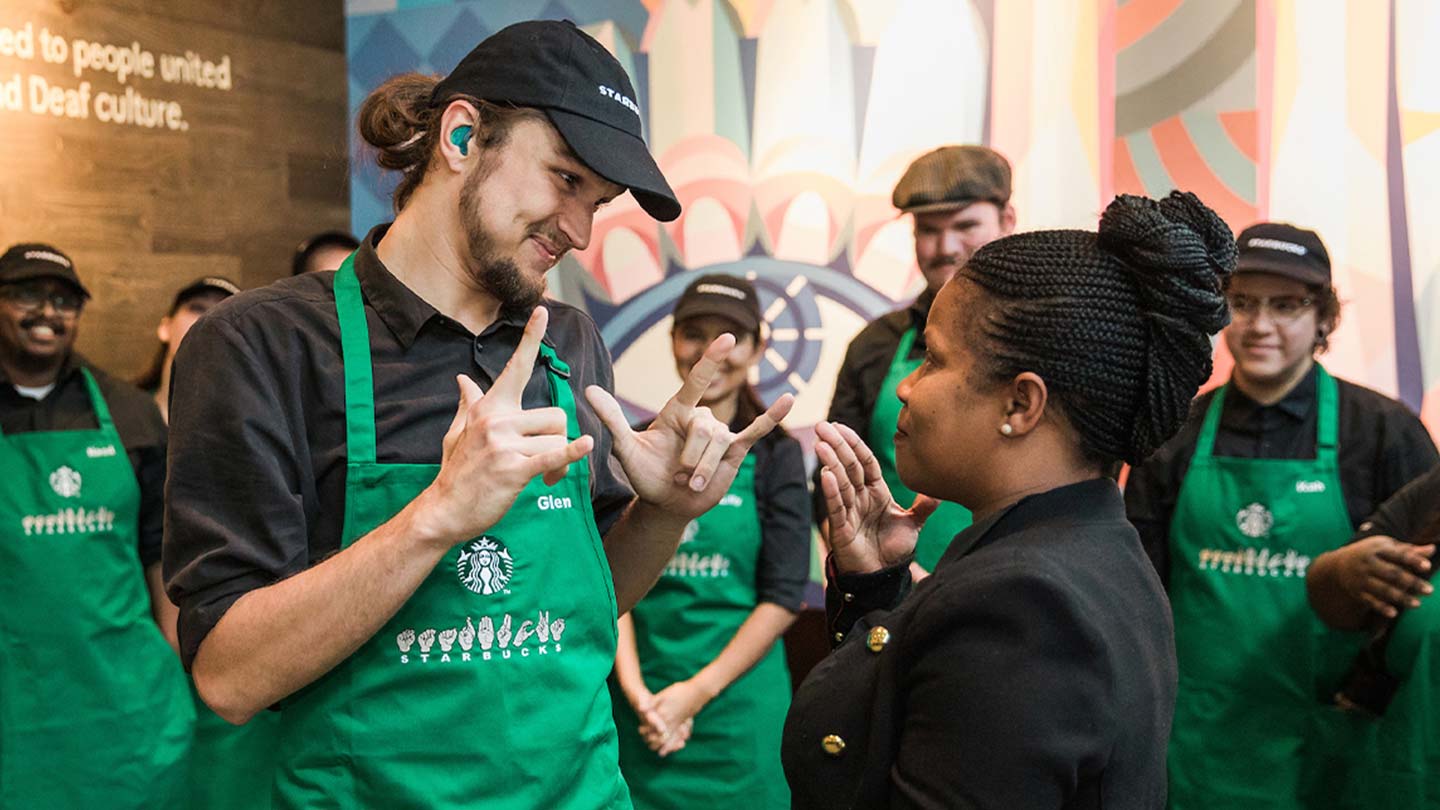 Starbucks partners communicating in ASL