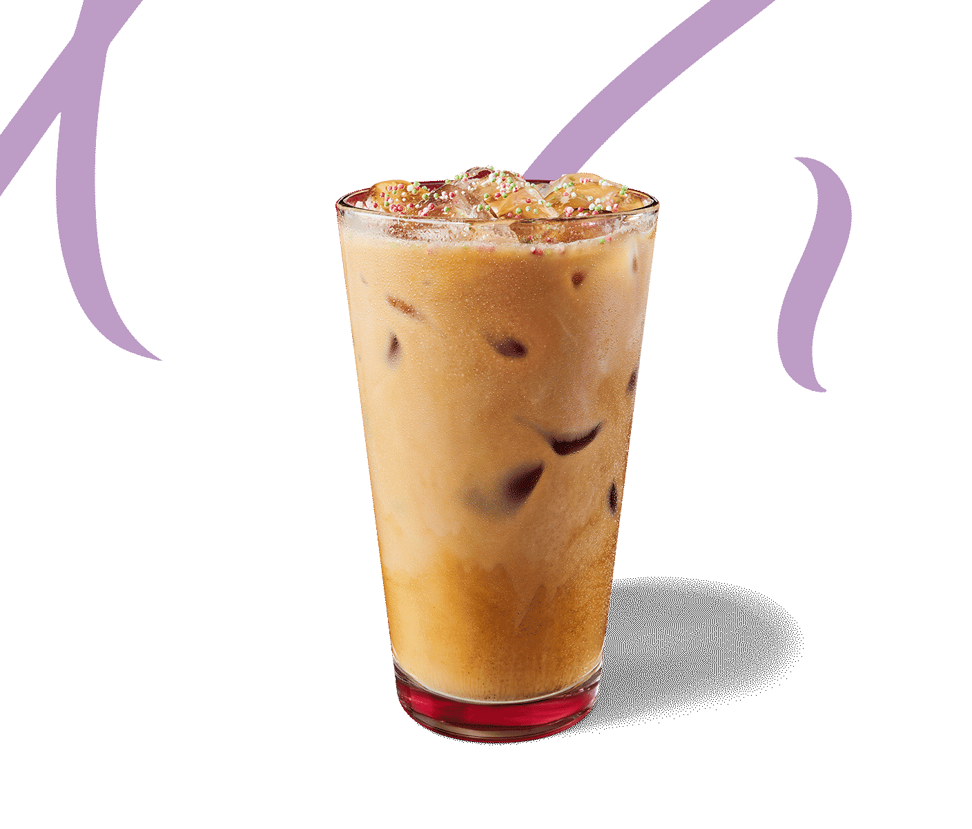 Iced coffee drink with red-and-green sprinkles in a glass against a red background.