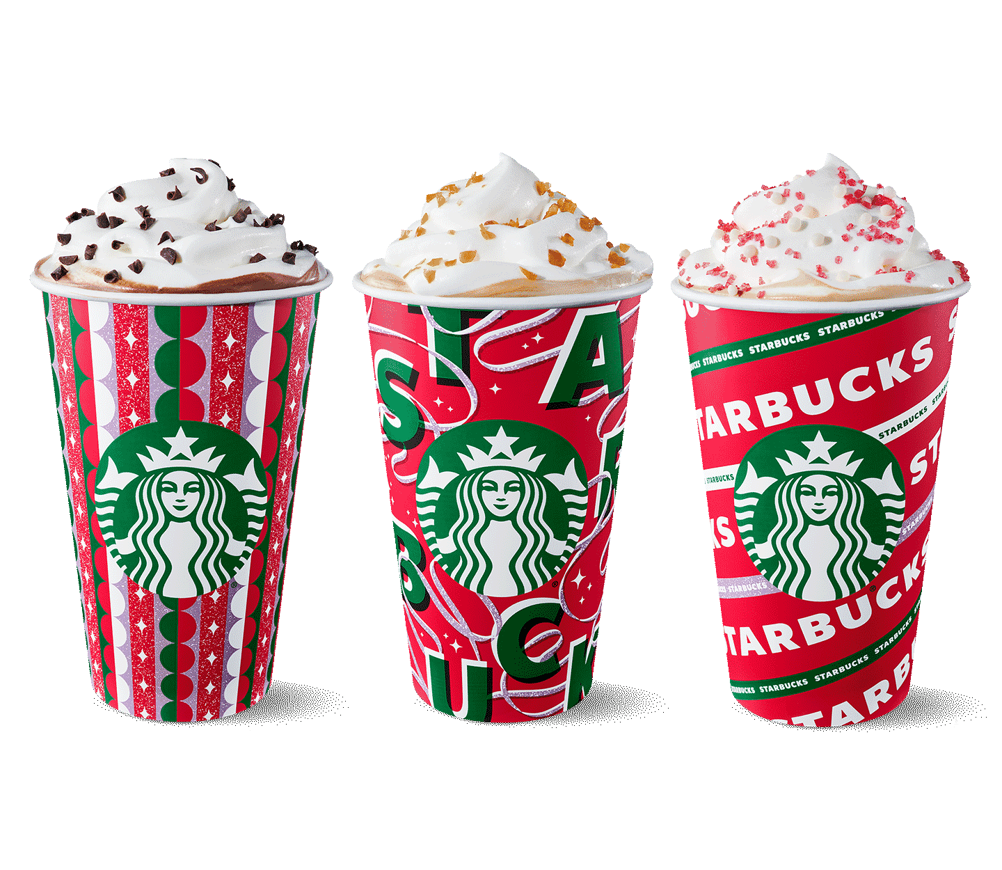 Three to-go cups with red-and-green holiday designs against a red background. The drinks are topped with whipped cream.