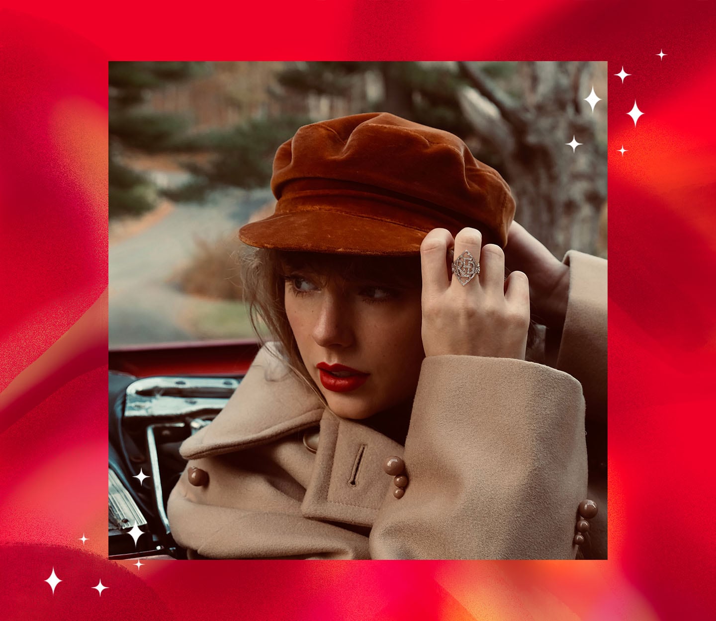 A photograph of Taylor Swift wearing a hat and decorative ring.