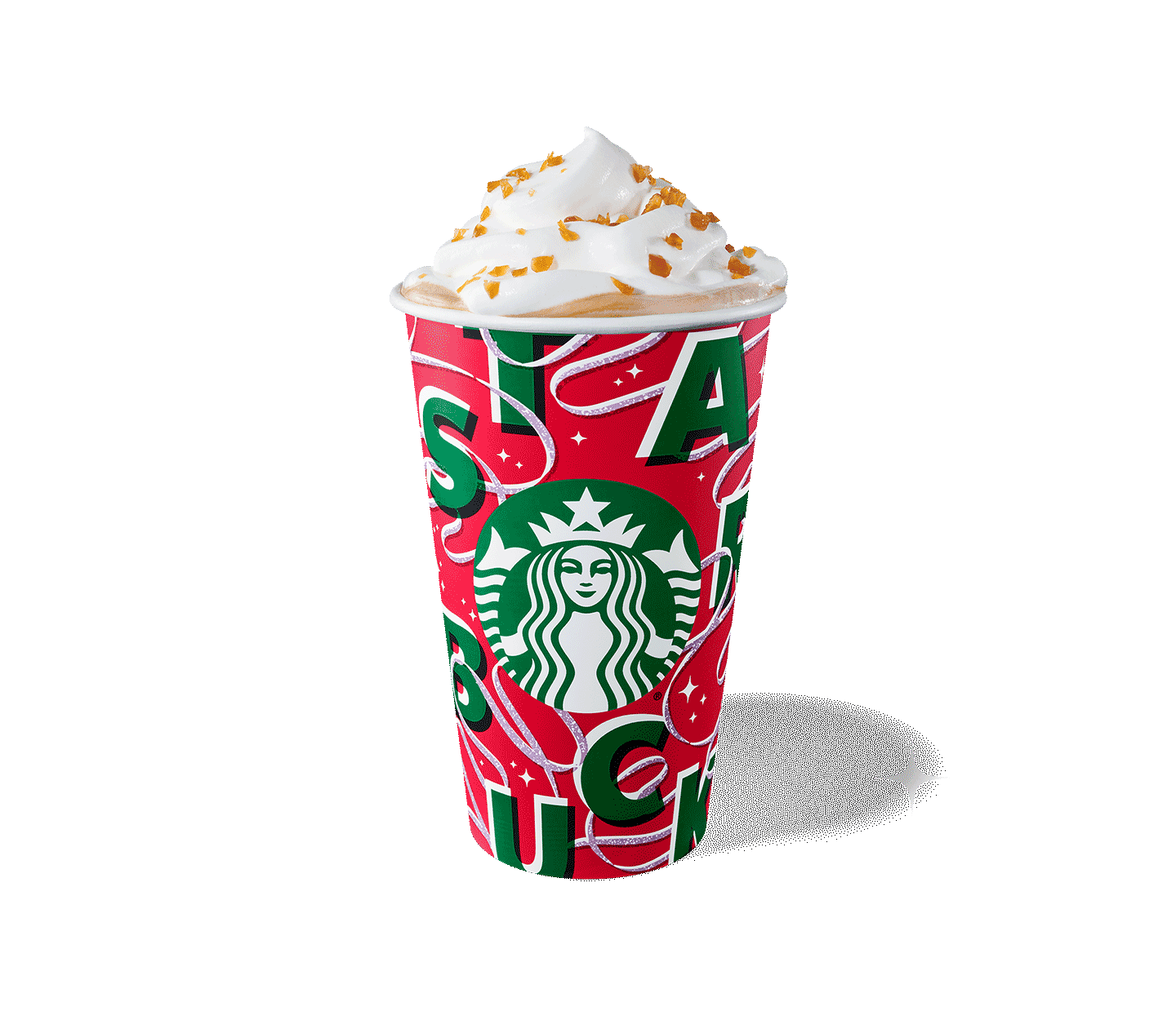 To-go cup with a red-and-green holiday design against a red background. Drink is topped with whipped cream.