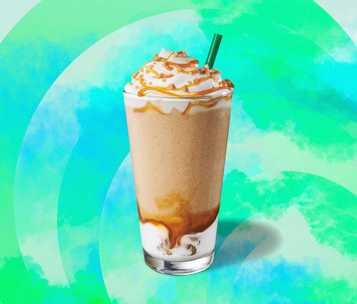 Blended coffee drink with caramel drizzle in a tall glass.