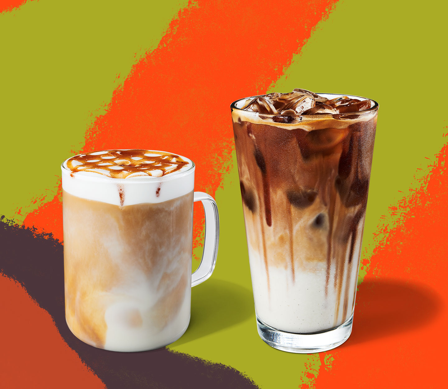 Clear mug contains a coffee drink with foamy top, sitting next to layered iced coffee drink in a tall glass.