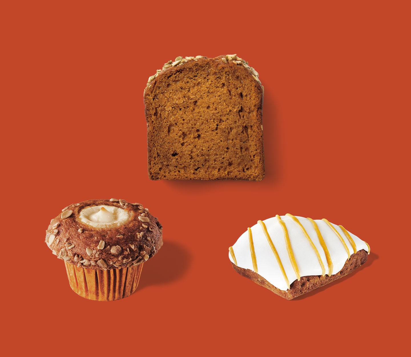 Three baked items form a triangular shape: Muffin with creamy center, slice of a loaf cake and frosted scone.