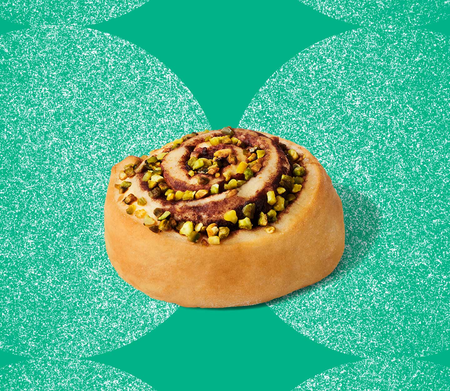 Round pastry swirl filled with chocolate and topped with chopped nuts.