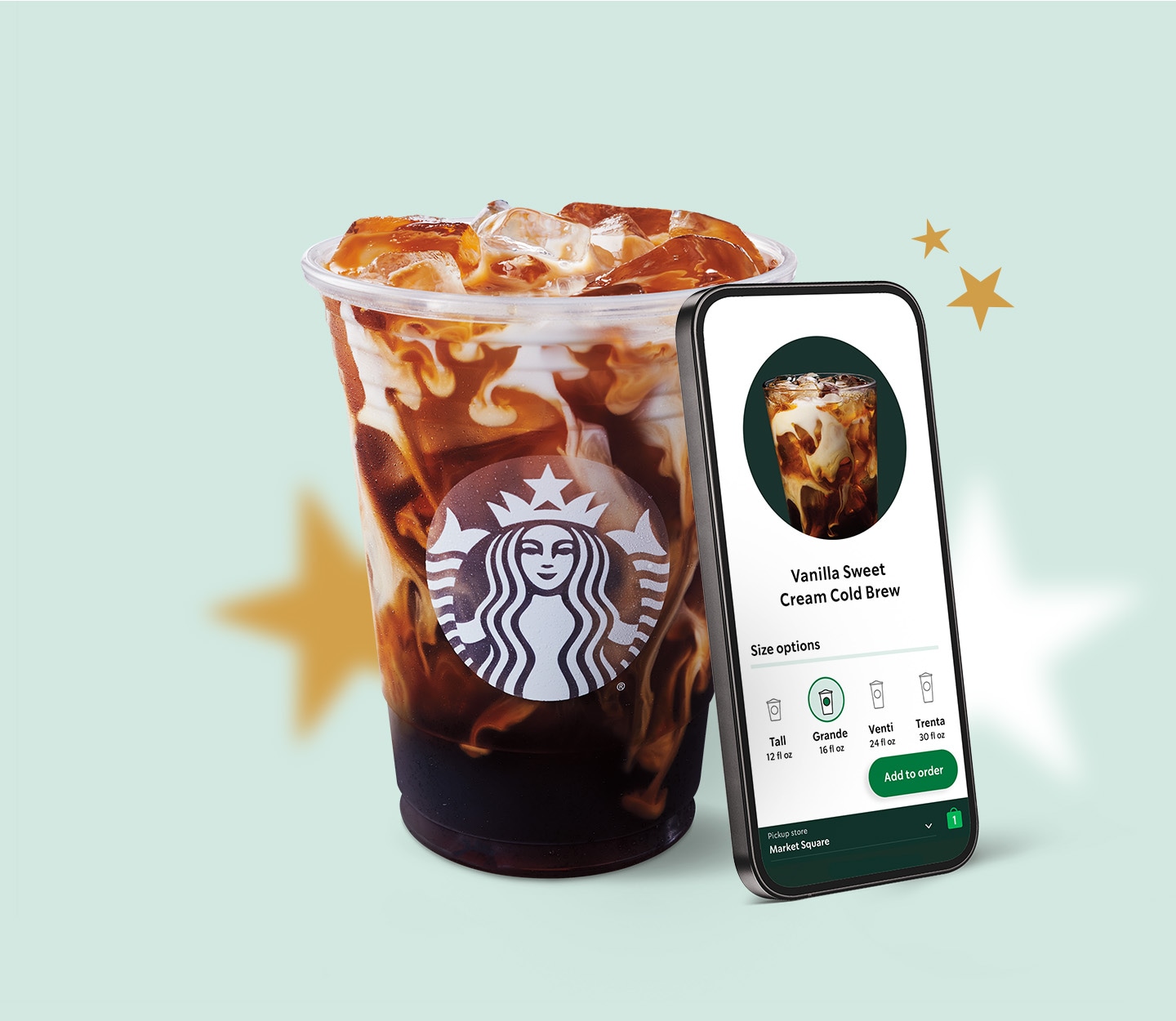 A starbucks coffee beside a phone showing the starbucks mobile app