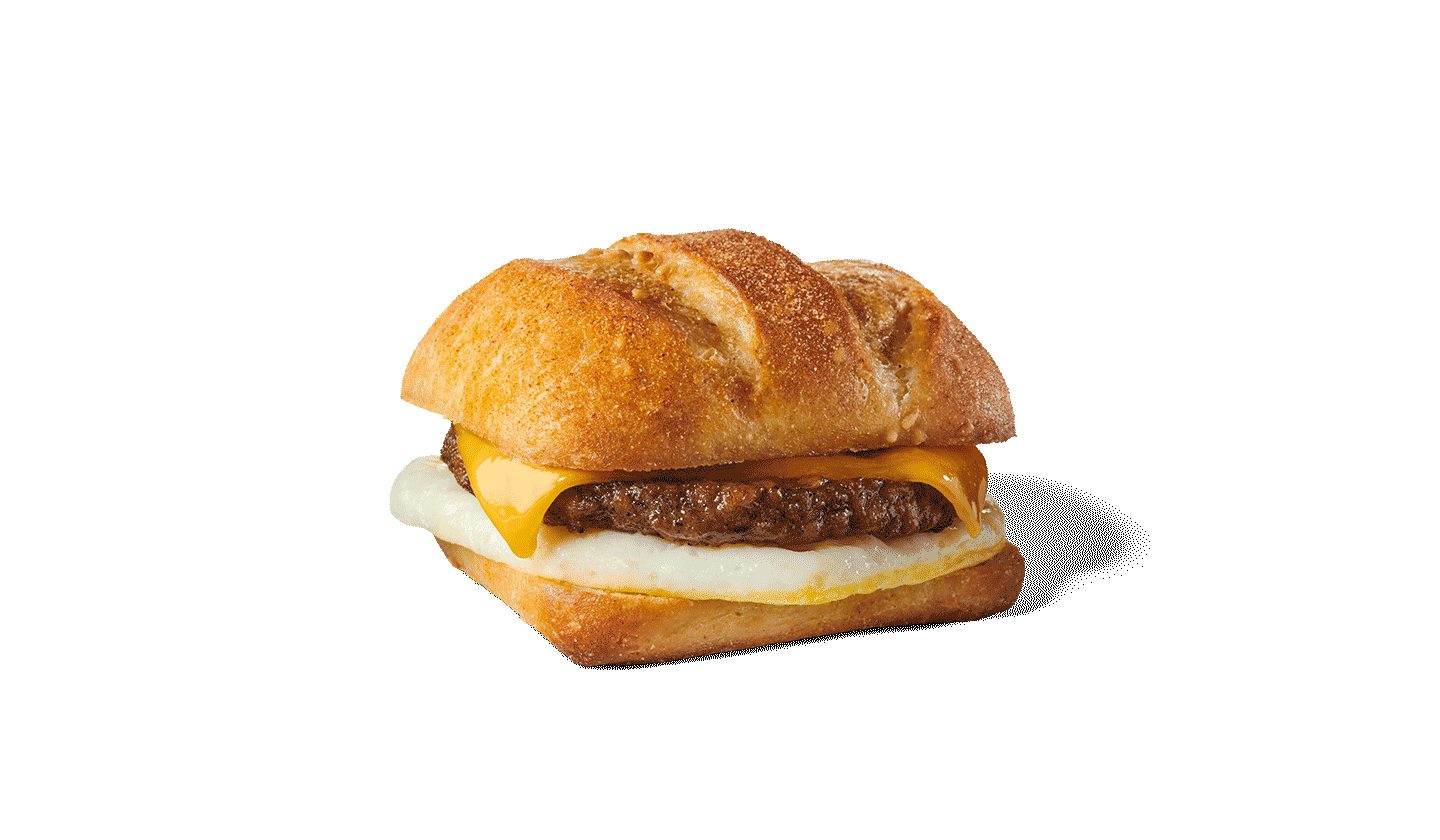 Plant-based sausage patty, melted cheese and an egg patty layered in a sesame bun.