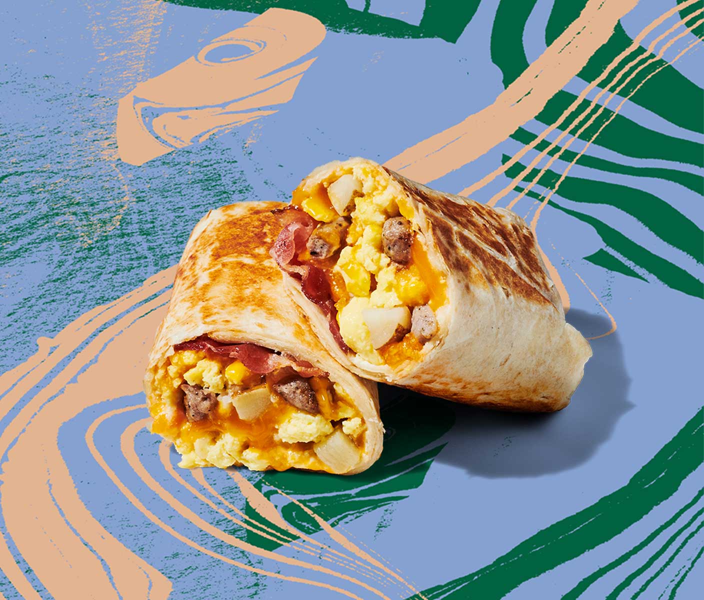 A breakfast wrap cut in half and stacked on top of itself, displaying mix of ingredients inside.