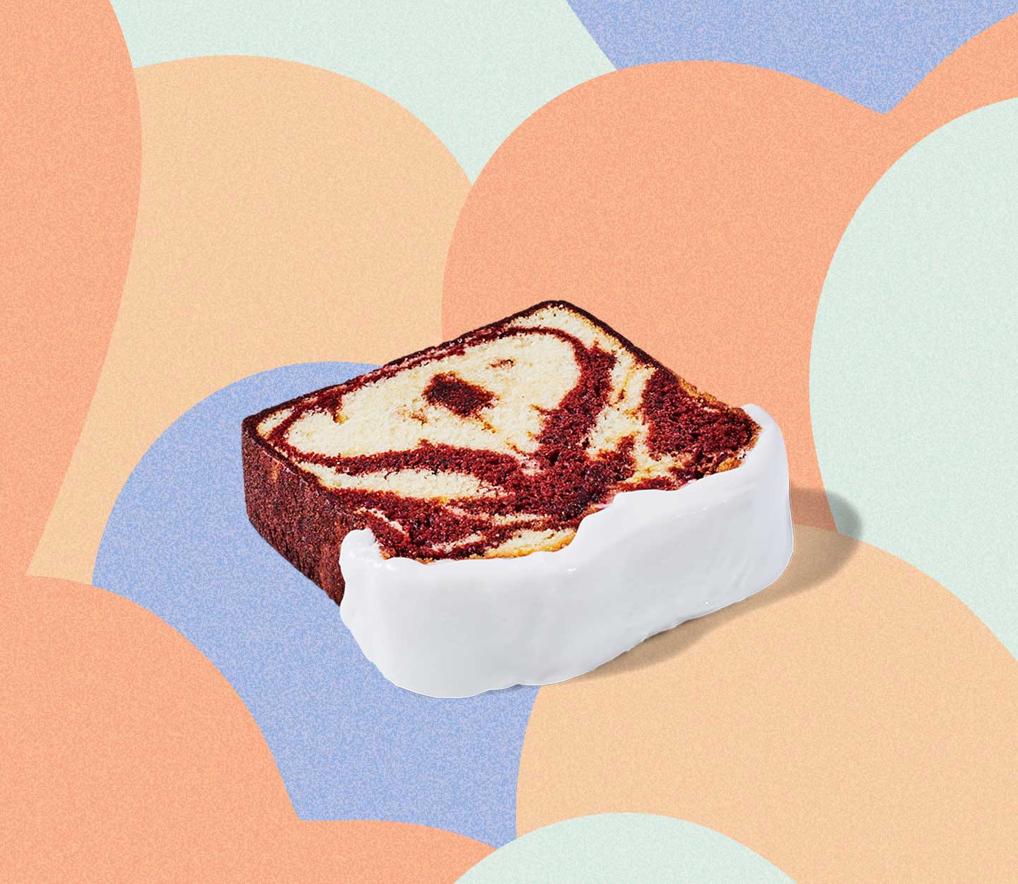 A slice of white cake on its side swirled with red velvet cake, a section of white frosting showing on the end.