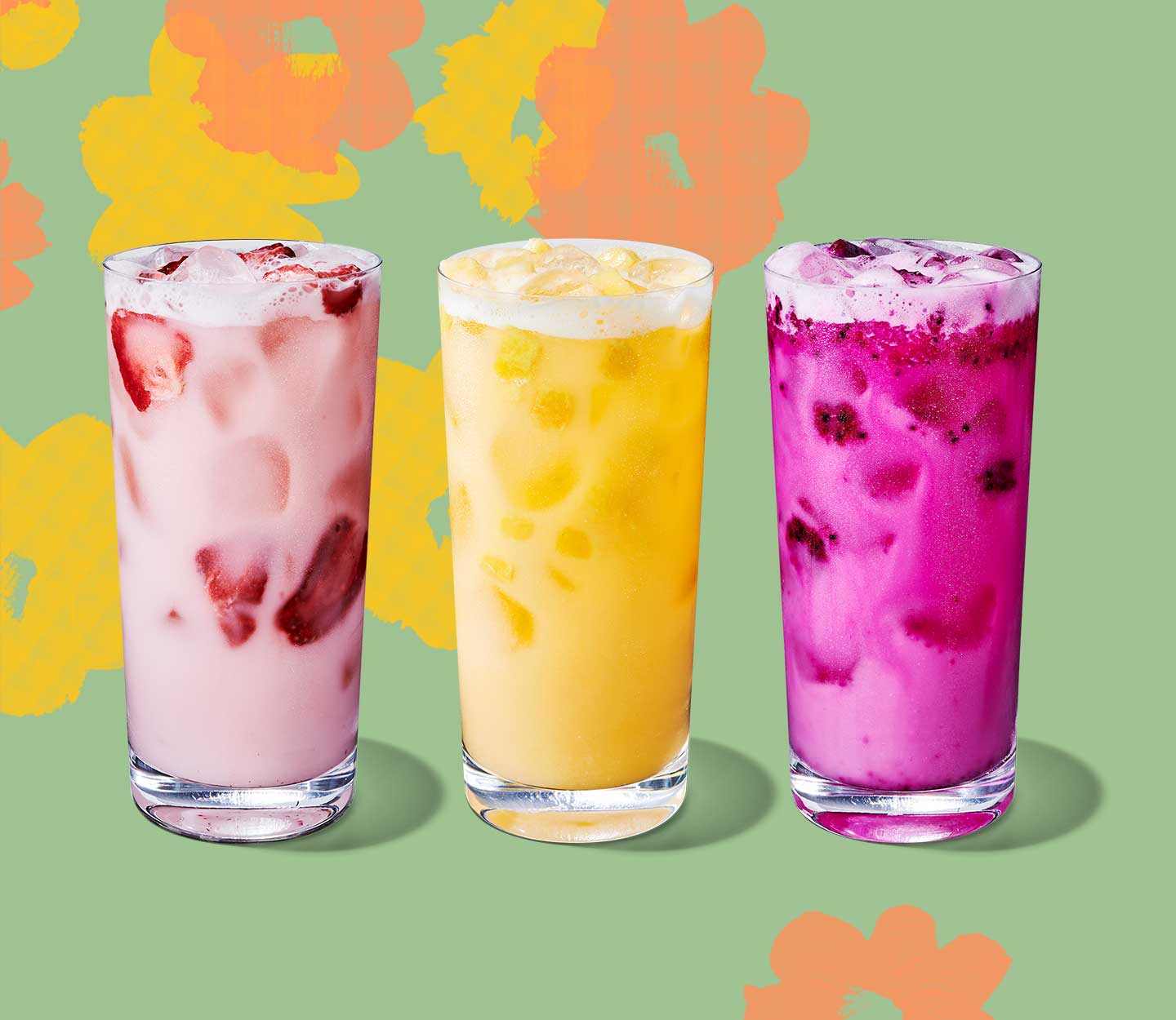 Pink, yellow and magenta iced drinks with fruit inclusions in tall glasses.