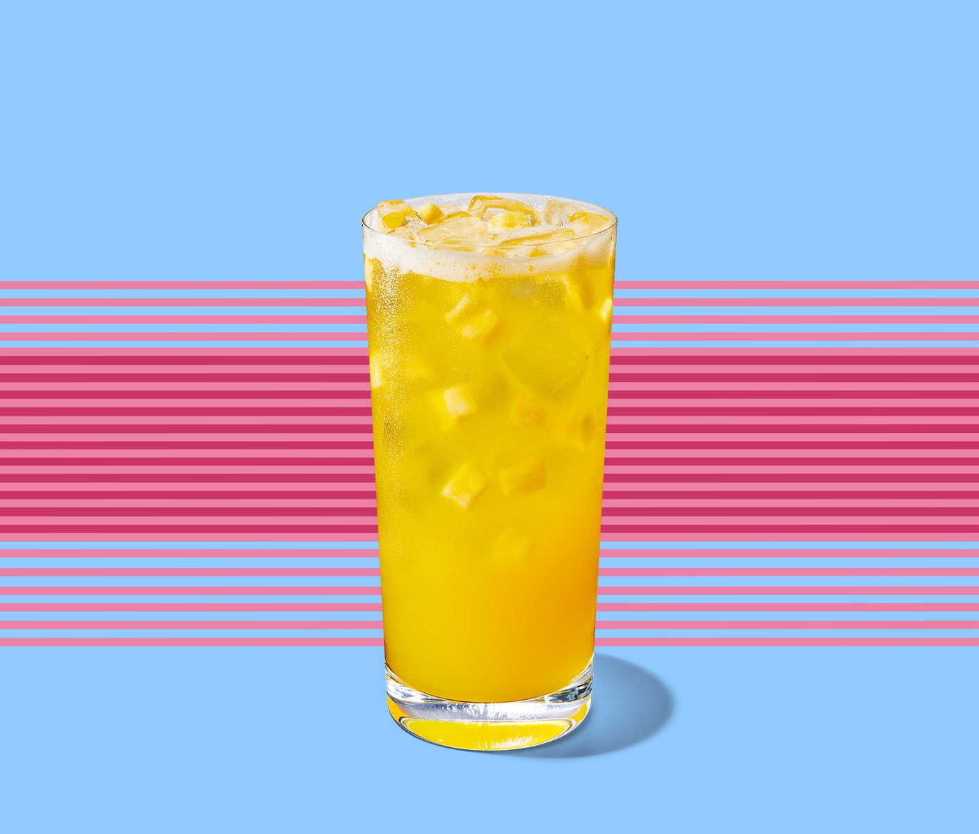 Bright, semi-translucent drink with fruit inclusions in a tall, narrow glass. Thin, horizontal lines form a background behind.