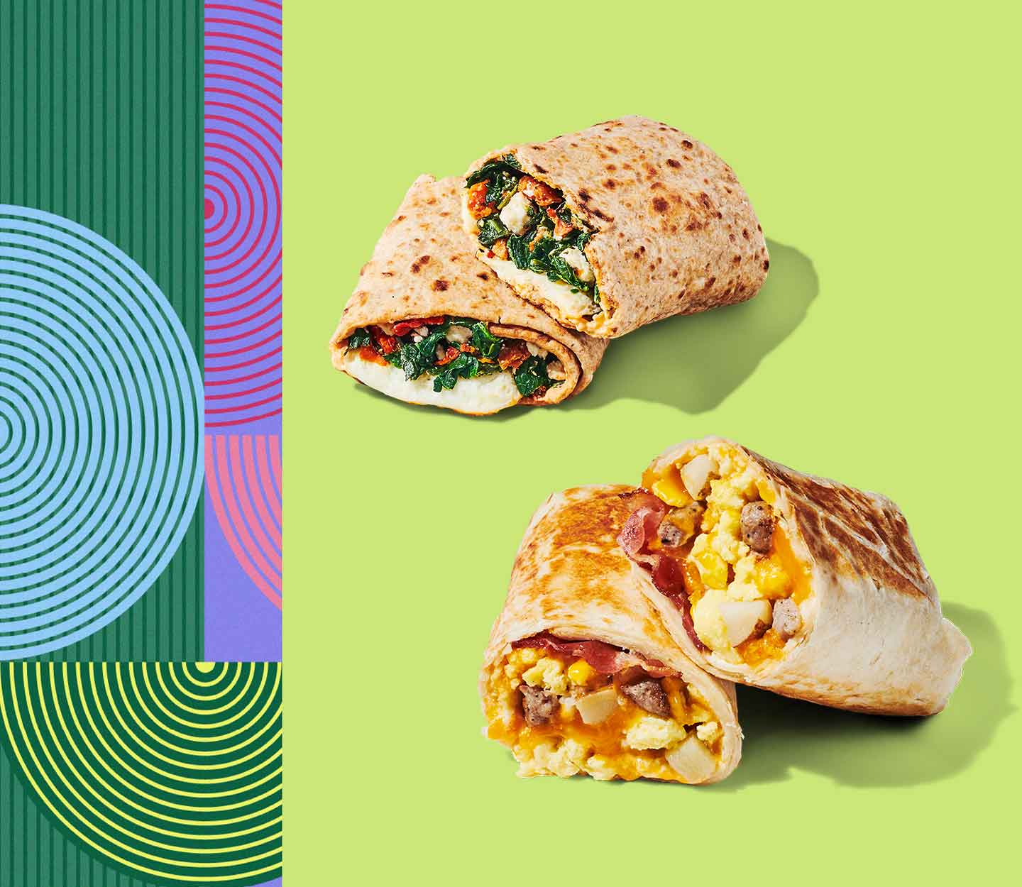 Two wraps sliced in half and stacked on top of themselves, revealing a combination of savory ingredients inside.