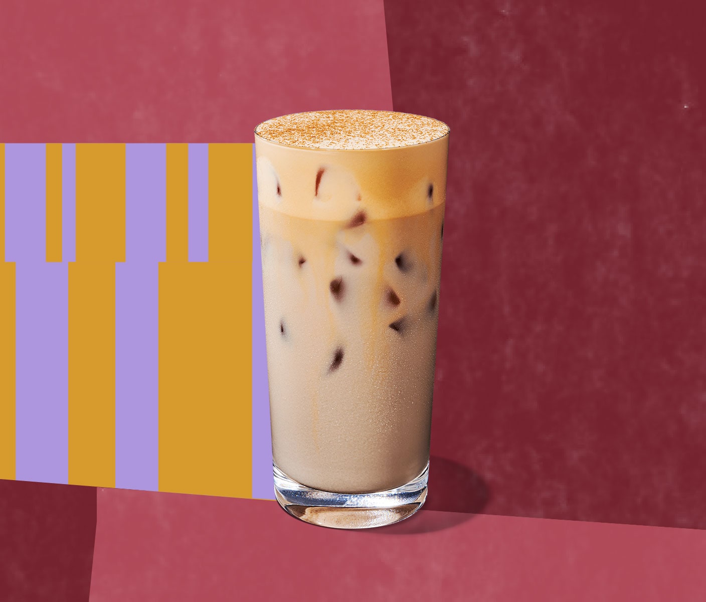 An iced, creamy tea drink with a layer of foaminess in a tall glass.