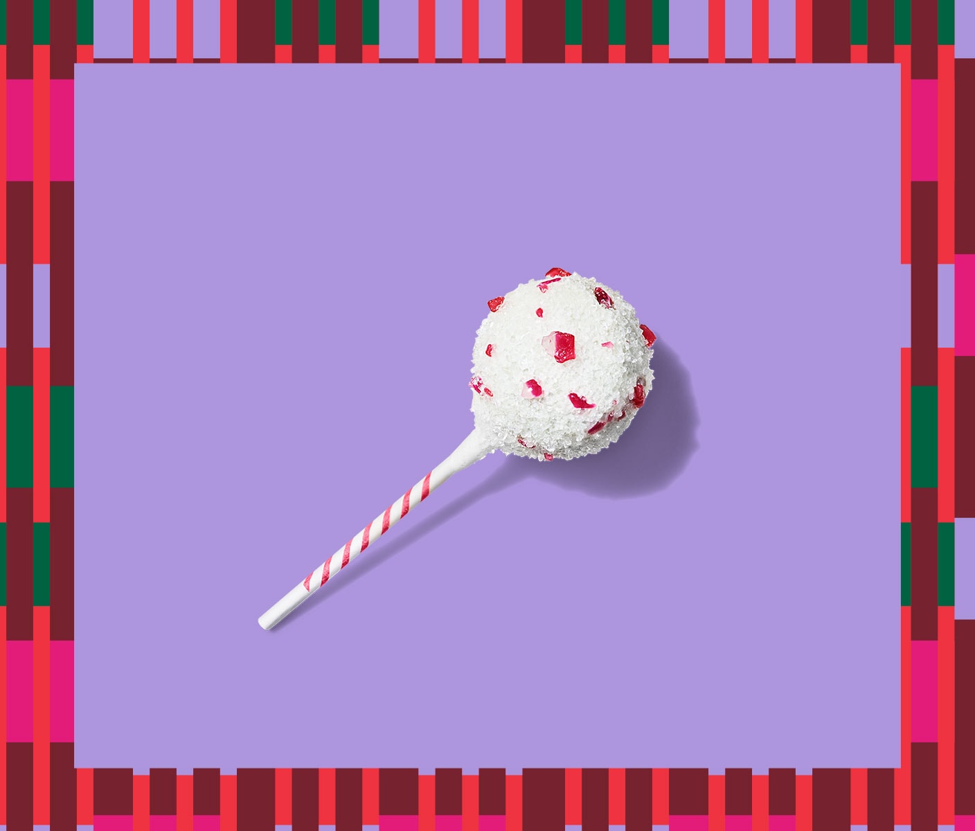 Cake pop with white icing and candy cane bits.