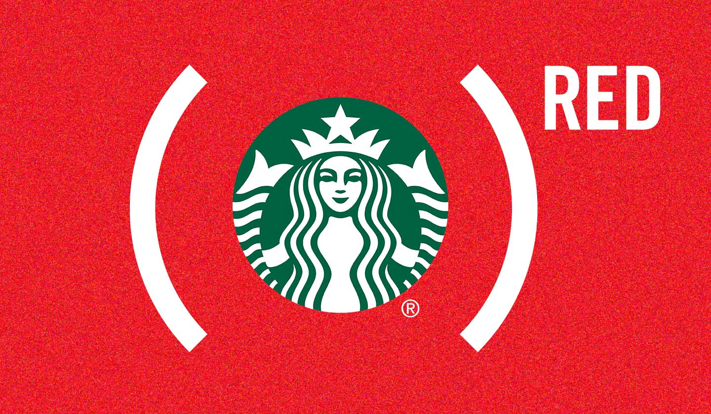 Starbucks logo inside of the RED parentheses on a background of blurred green, teal, yellow and red.