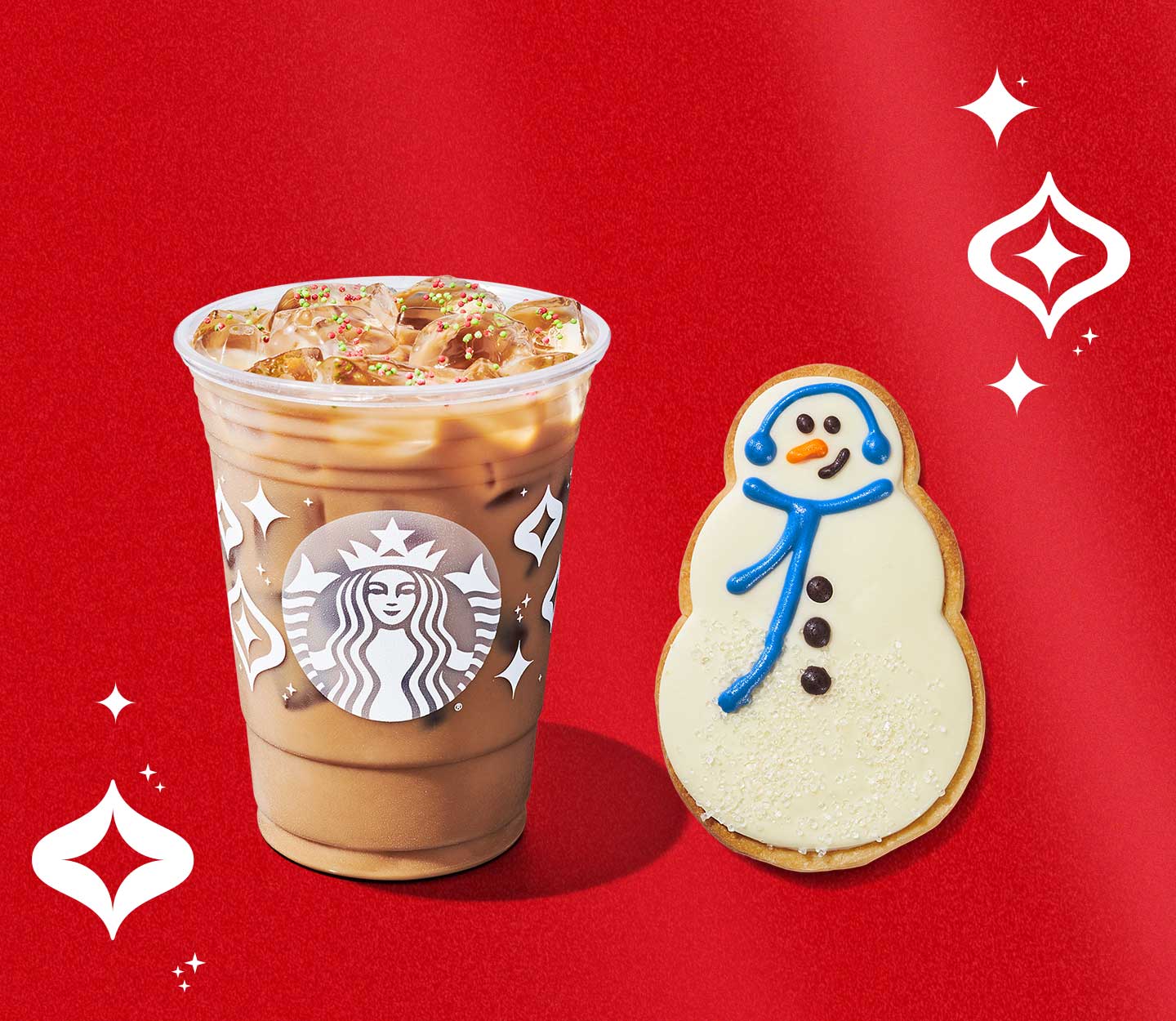 Creamy iced espresso drink and frosted snowman-shaped cookie.