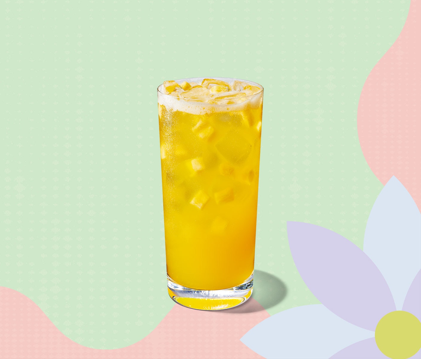 Bright-yellow iced drink with pineapple inclusions.