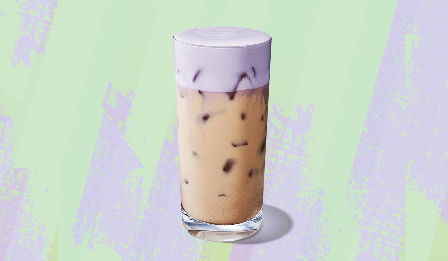 Iced chai tea with lavender-hued foamy topping.
