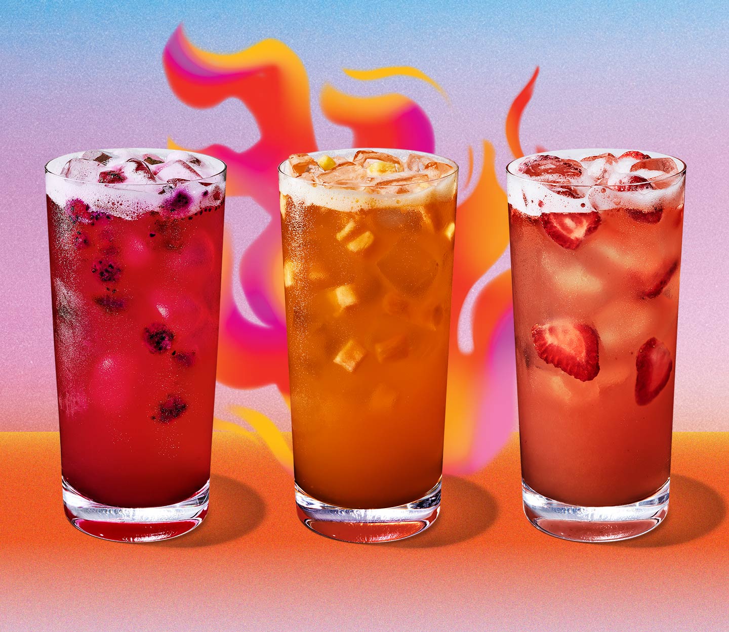 Three red, cold drinks with pieces of fruit in them. The shade of red progresses from pink to orange.