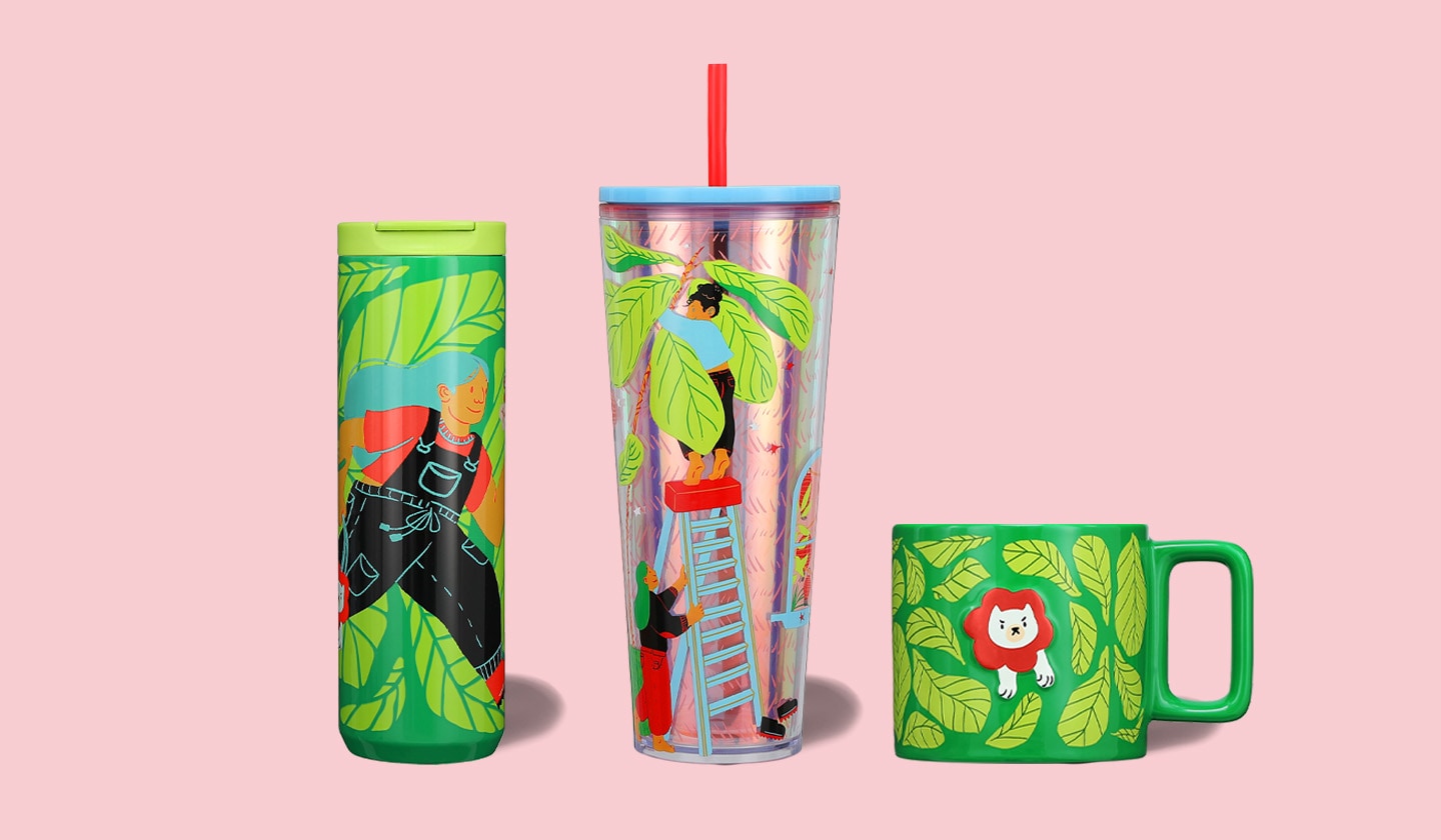 One tumbler, one cold cup, and one mug featuring Monyee Chau's art on a colored background.