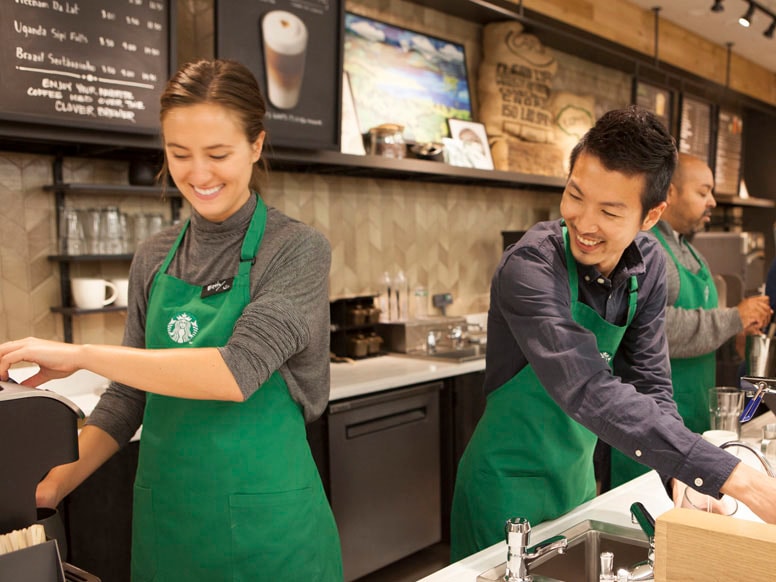 Starbucks baristas making beverages