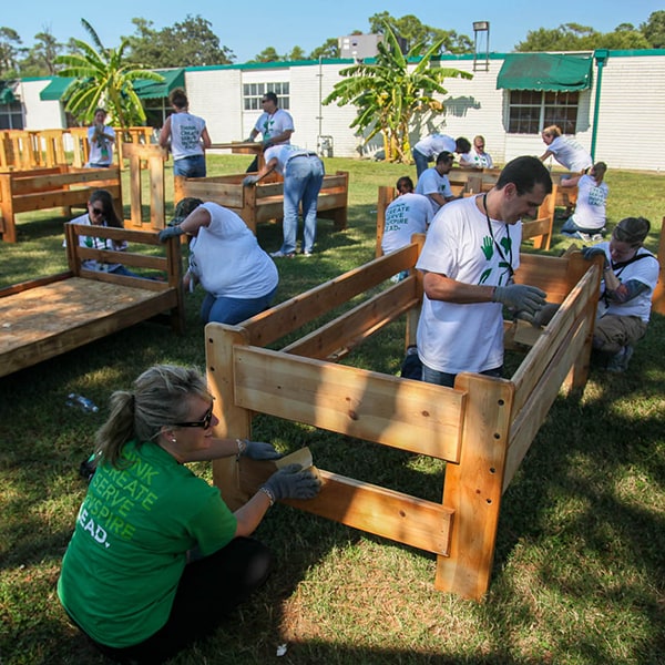 Group of partners volunteering to build flower beds