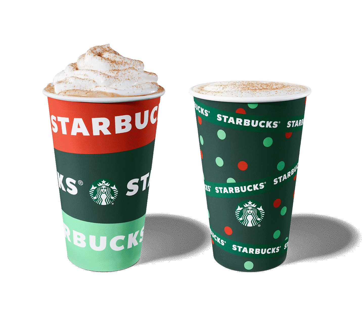 Warm beverages with foam and whipped cream on top served in holiday cups.