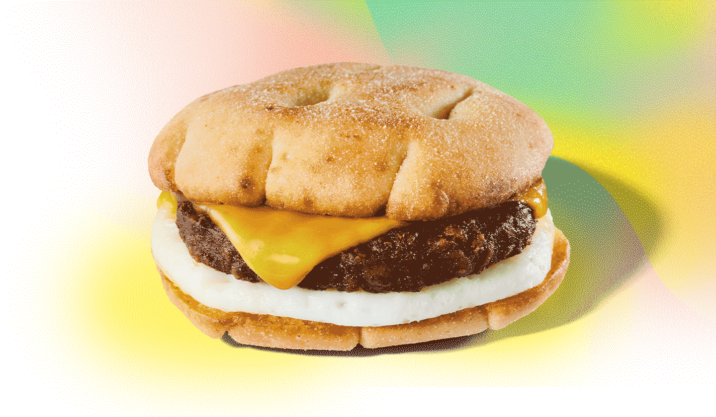A stacked sandwich against a colourful background