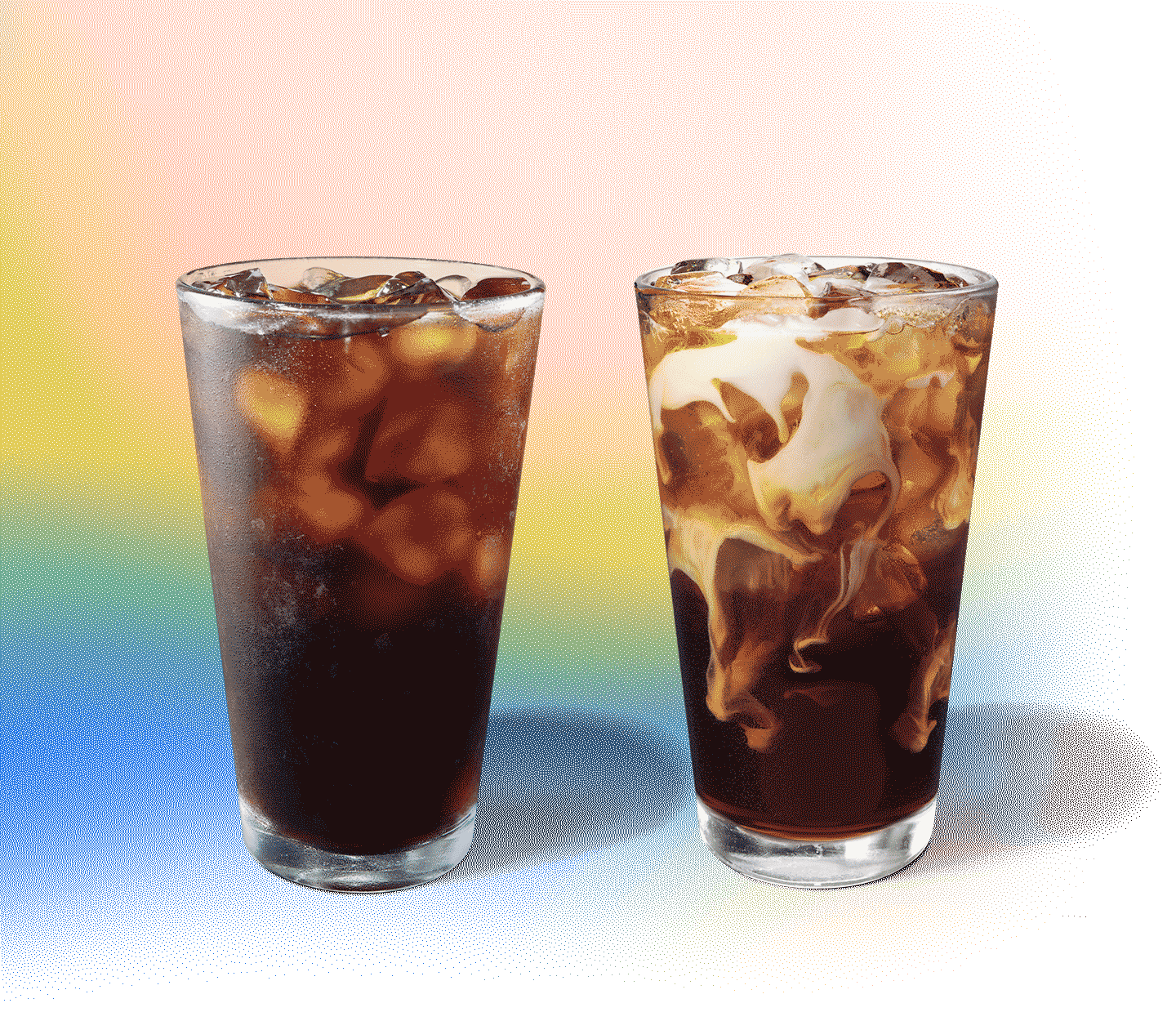 Two iced coffee drinks sit next to each other, one with creamy swirls.
