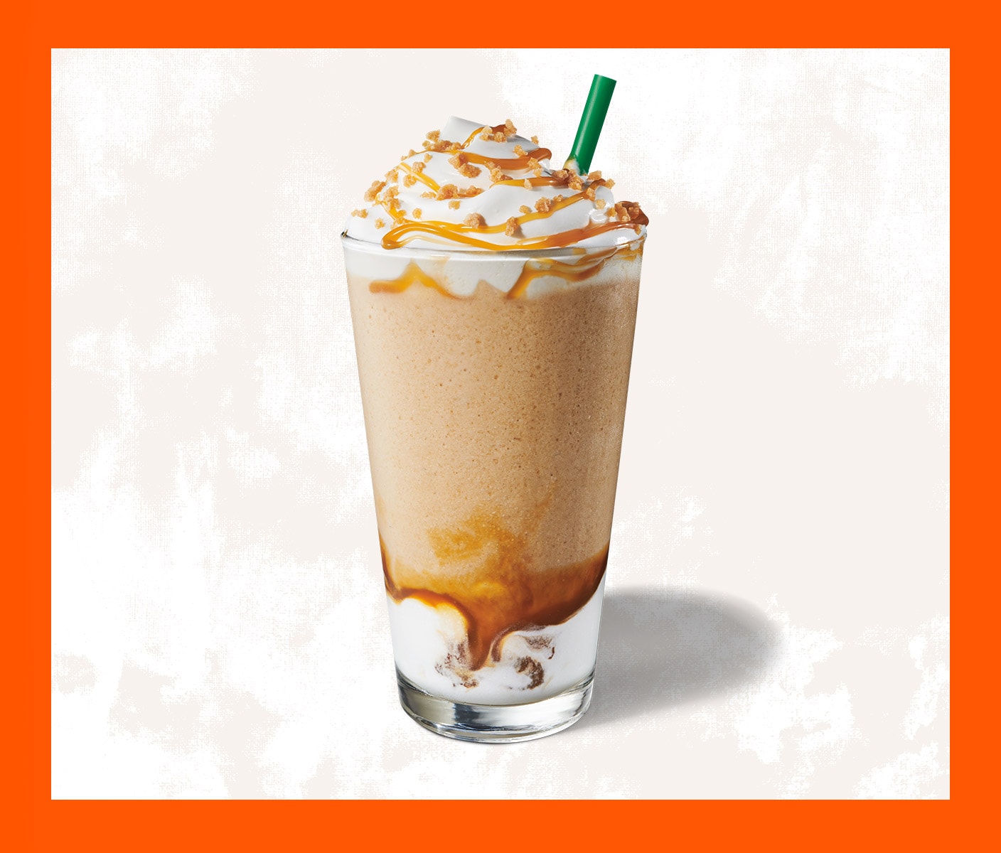 Blended coffee drink with whip cream in a tall glass.