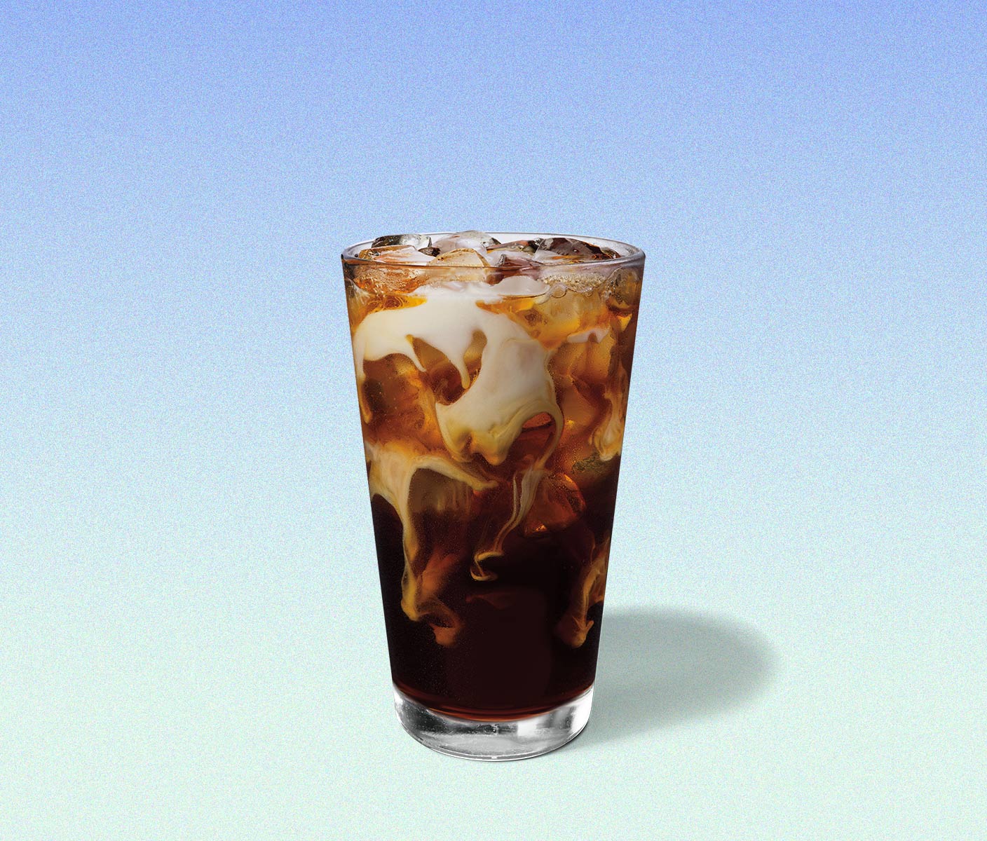 Marbled, iced coffee drink in a tall glass