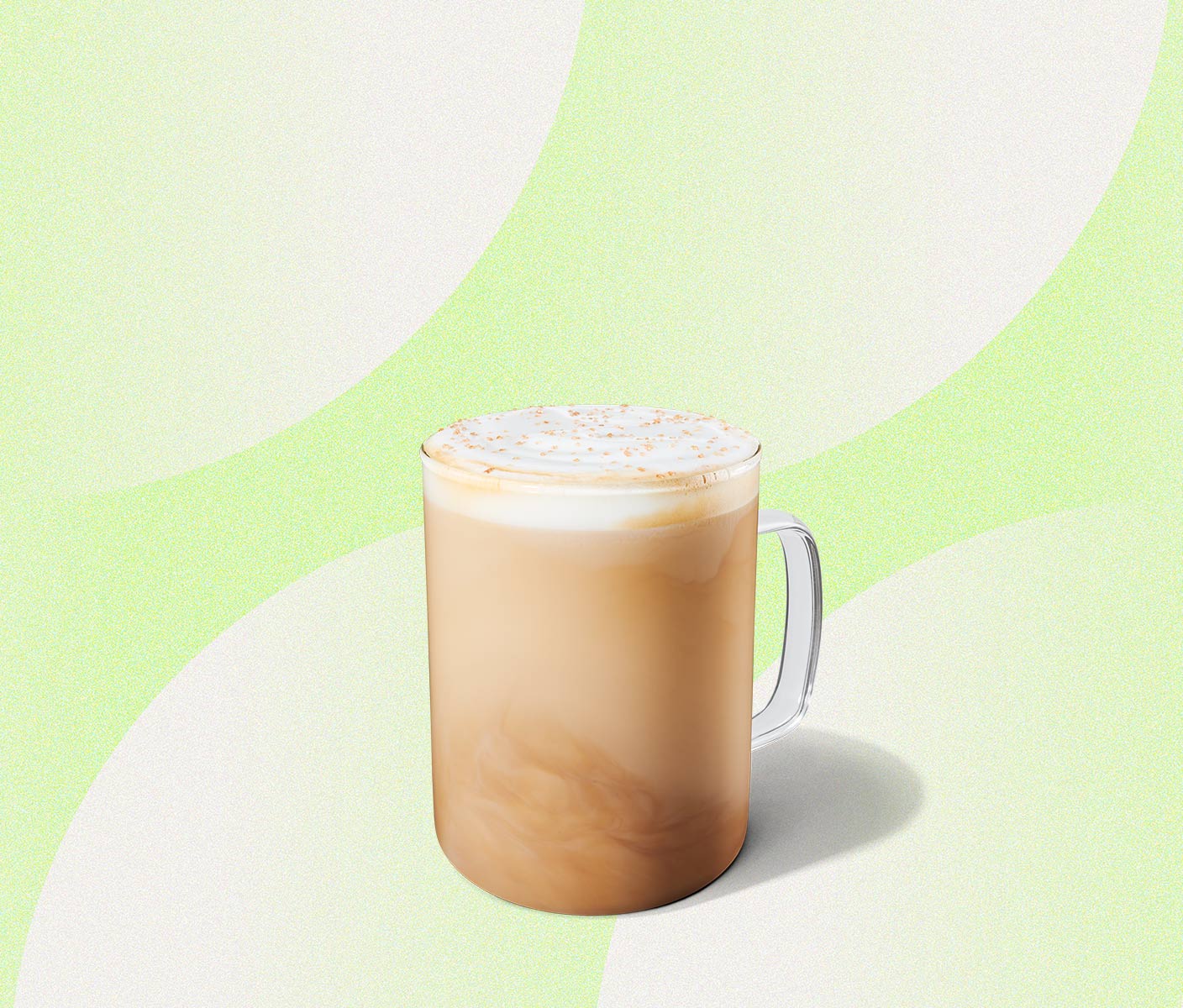 Creamy latte in a glass mug.