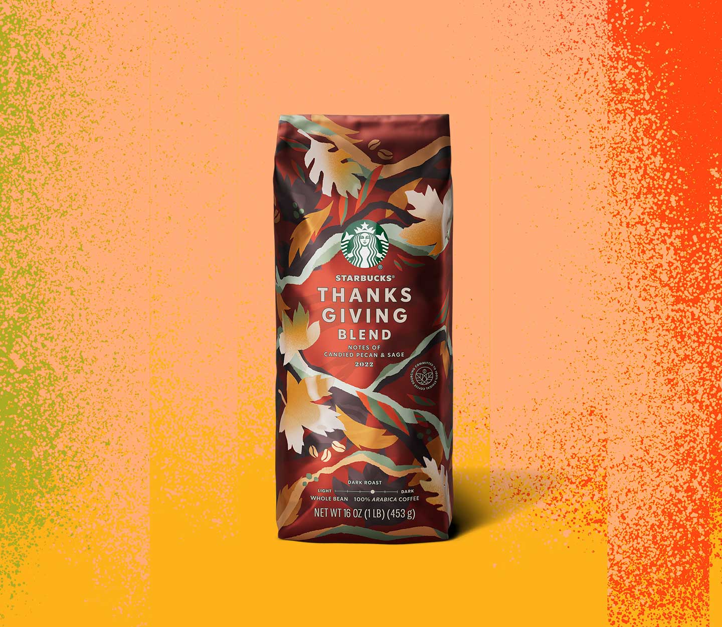 A coffee bag covered in illustrated orange and yellow jagged-shaped leaves.