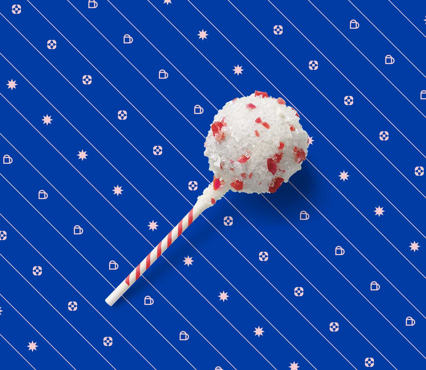 Cake pop covered in white icing and bits of candy cane.