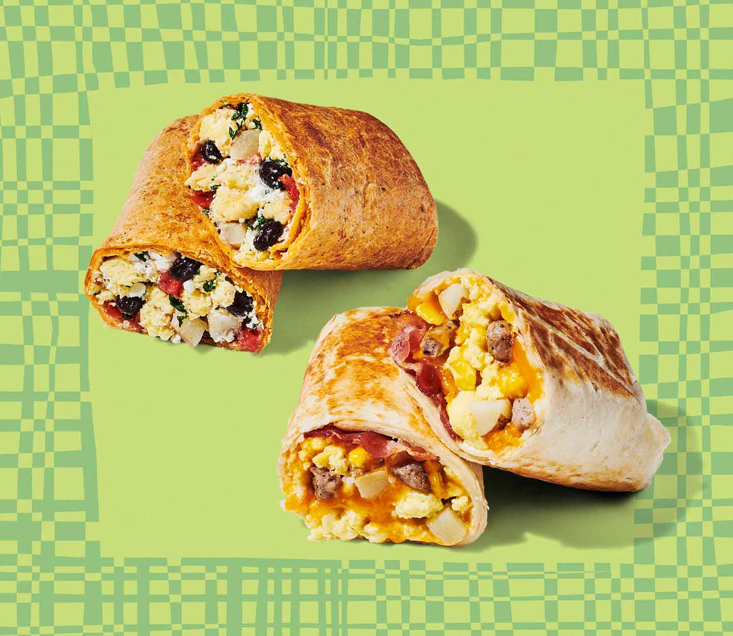 Two wraps cut in half to show ingredients layered inside.