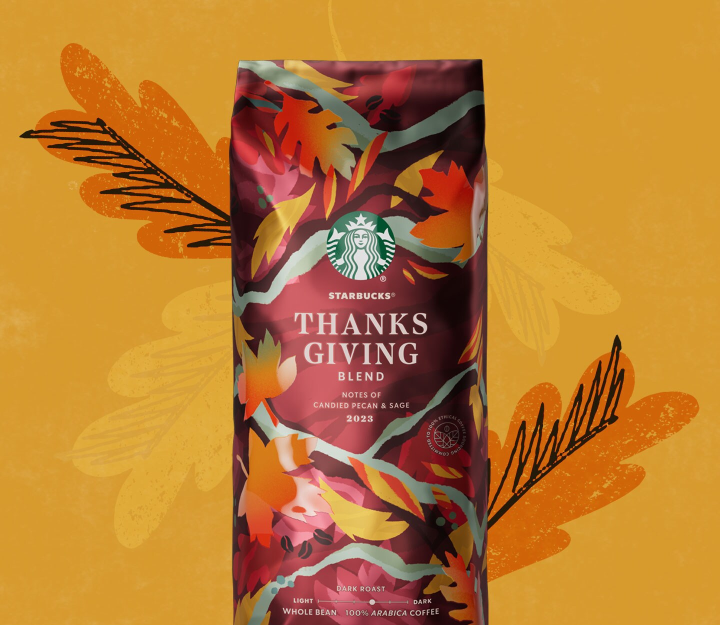 A package of coffee illustrated with multi-coloured leaves.