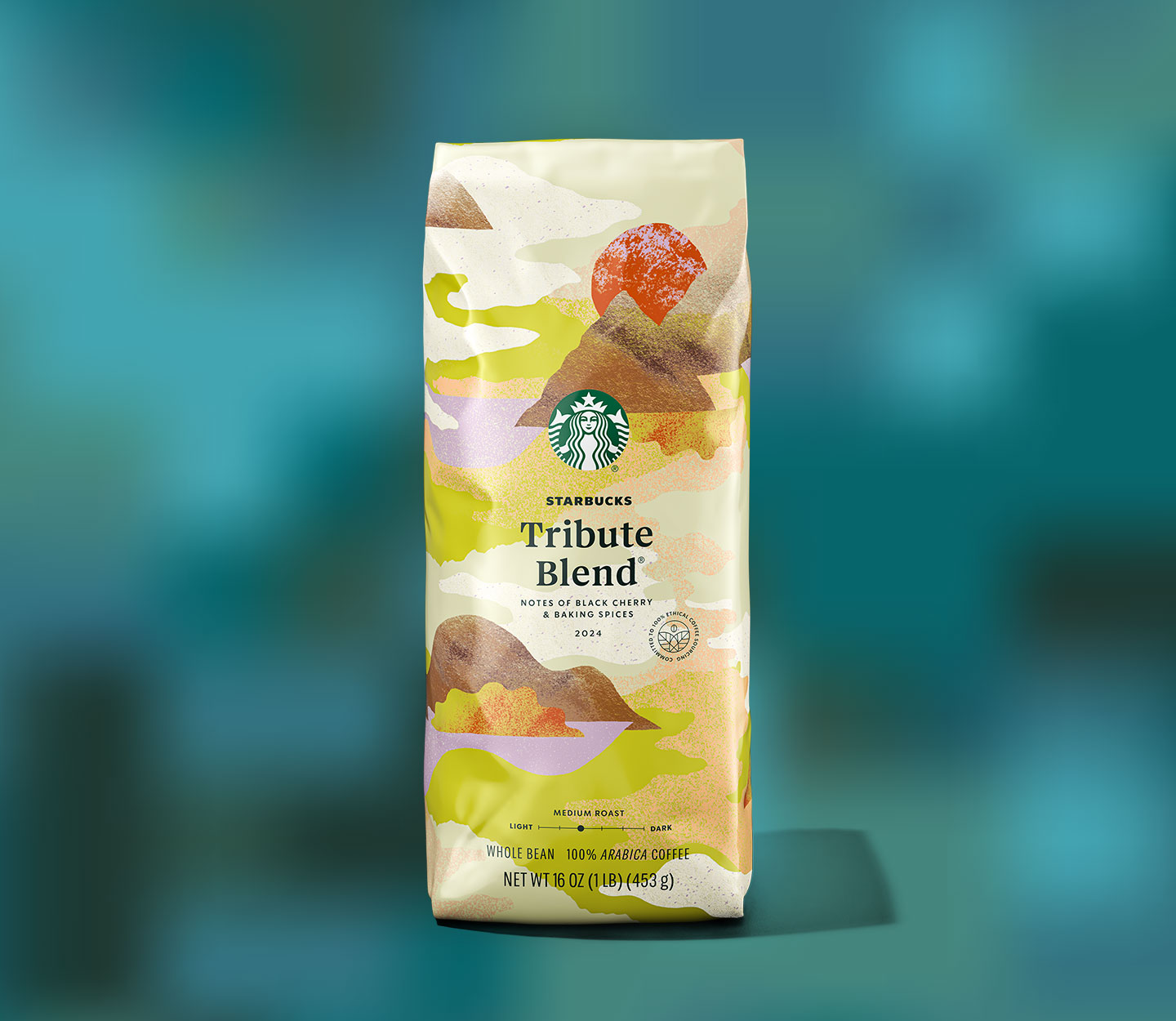 A bag of Starbucks Tribute Blend® coffee featuring an airy, mountainous illustration.