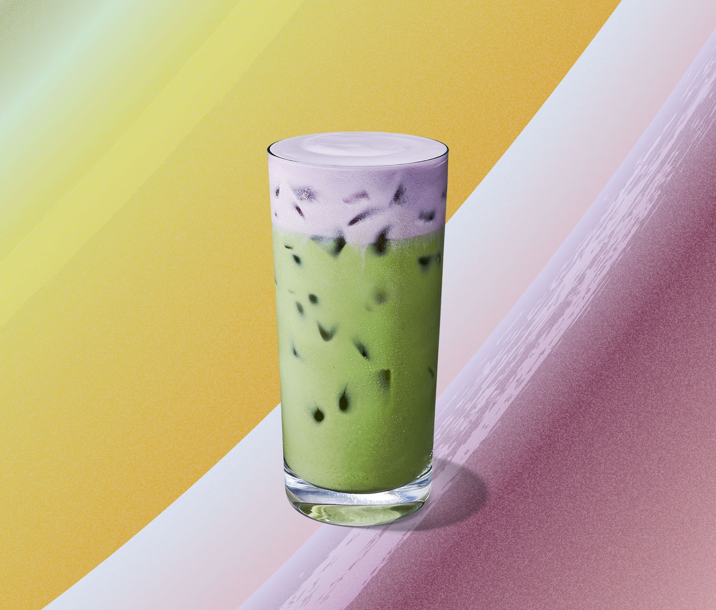 Iced green tea with a lavender-hued foamy topping.