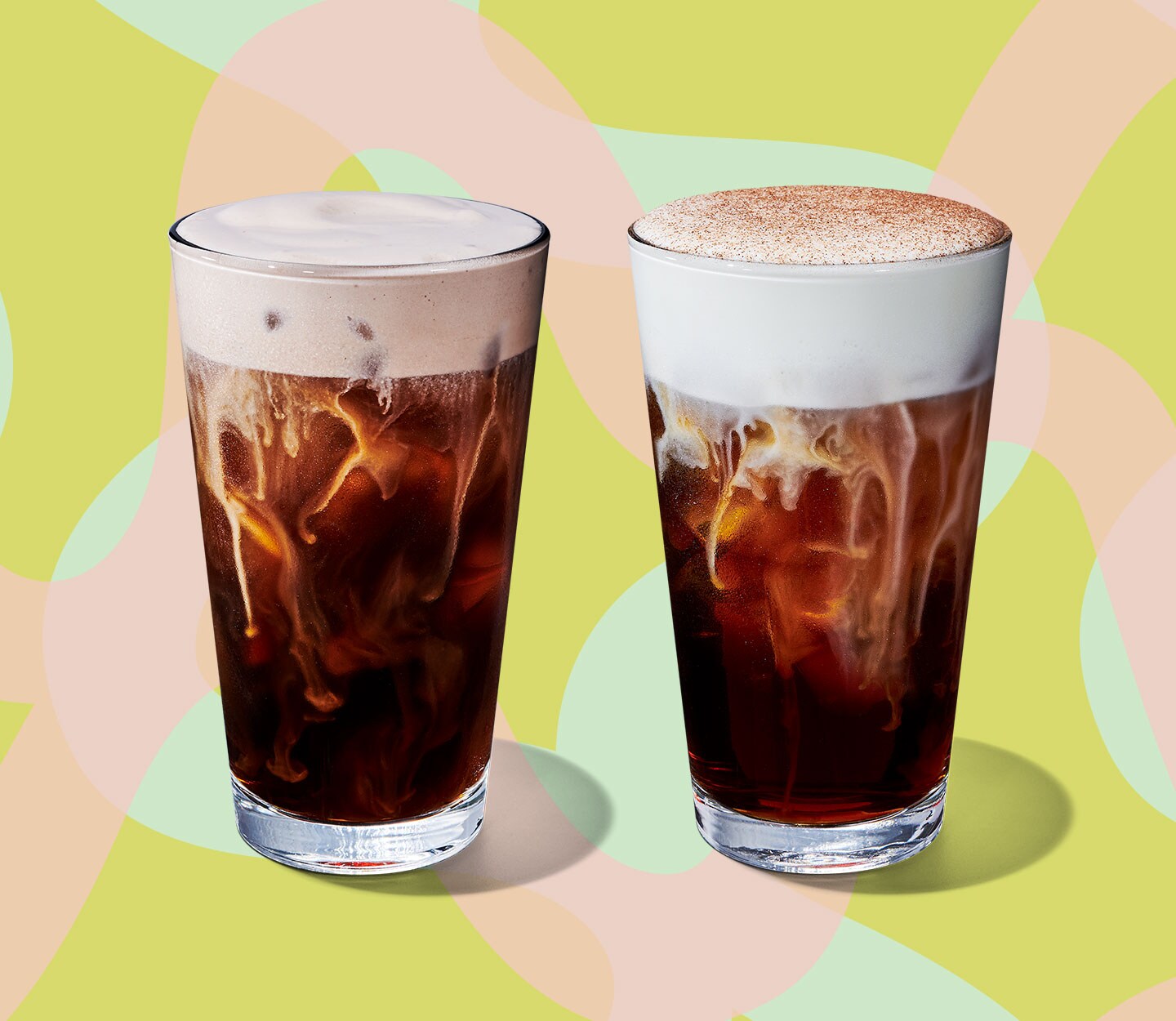 Two cold coffee drinks, each with a thick, foamy topping.