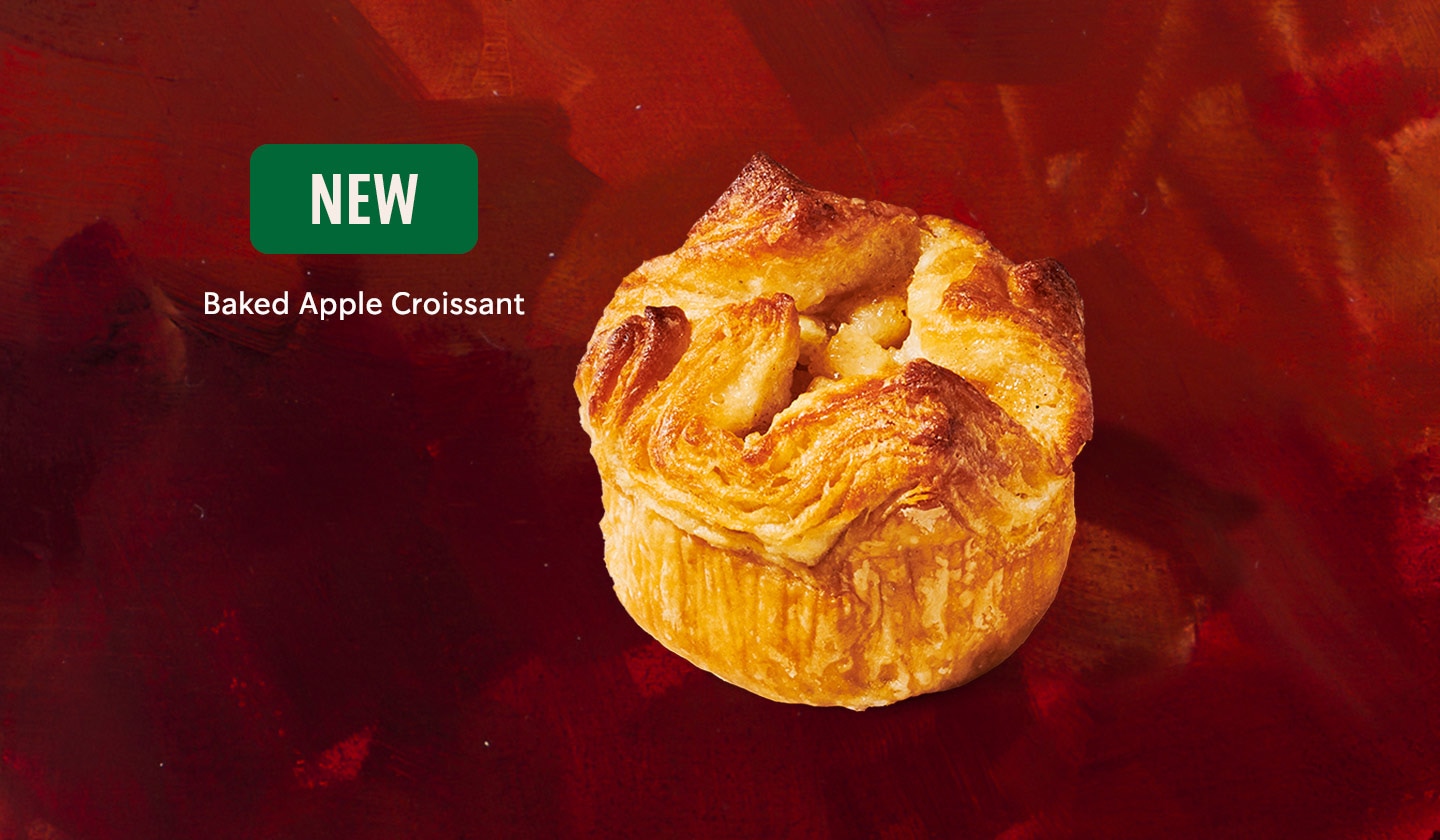 A perfectly toasted flaky Baked Apple Croissant shining with apple sweetness