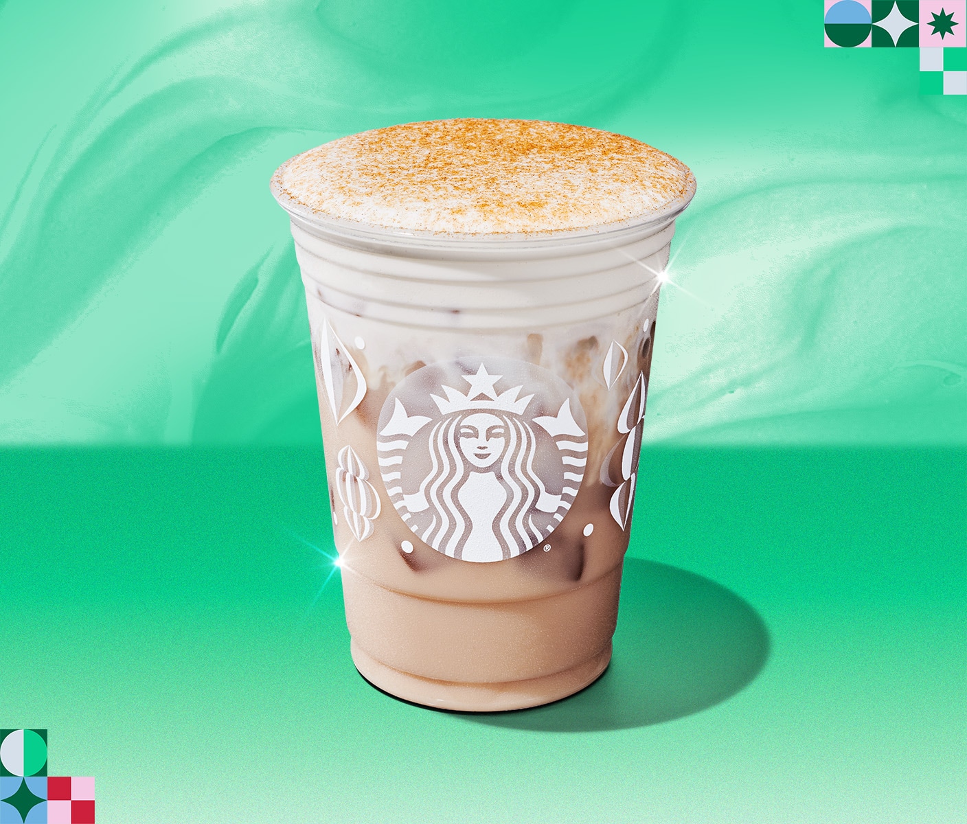 A Starbucks holiday beverage in a takeaway cup